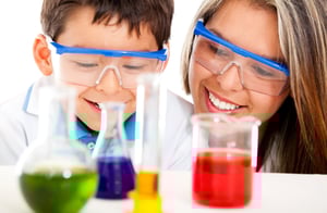Mother and son at the lab playing scientist - isolated over white